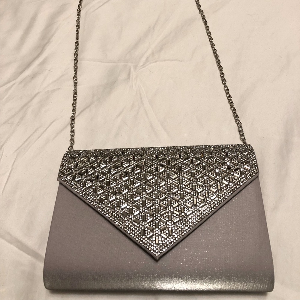 Jessica McClintock silver clutch with metal chain.